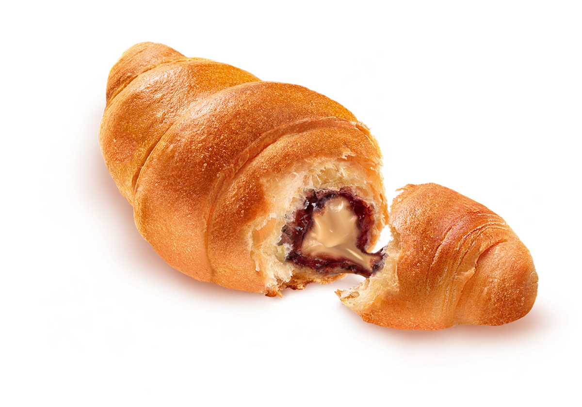 Peanut butter and jelly croissant ripped in half with peanut butter and jelly oozing out