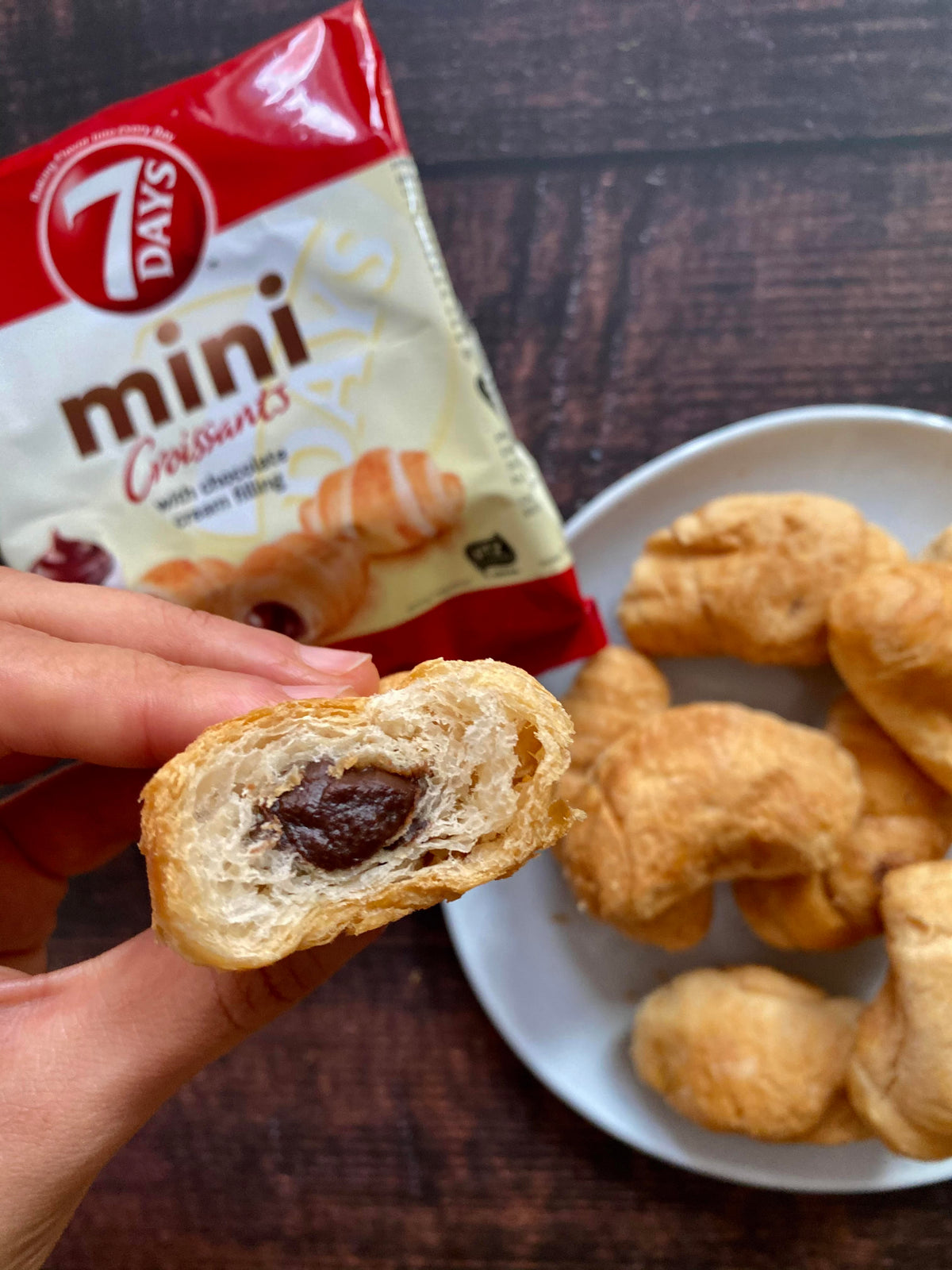 half of a mini chocolate croissant showing chocolate filling